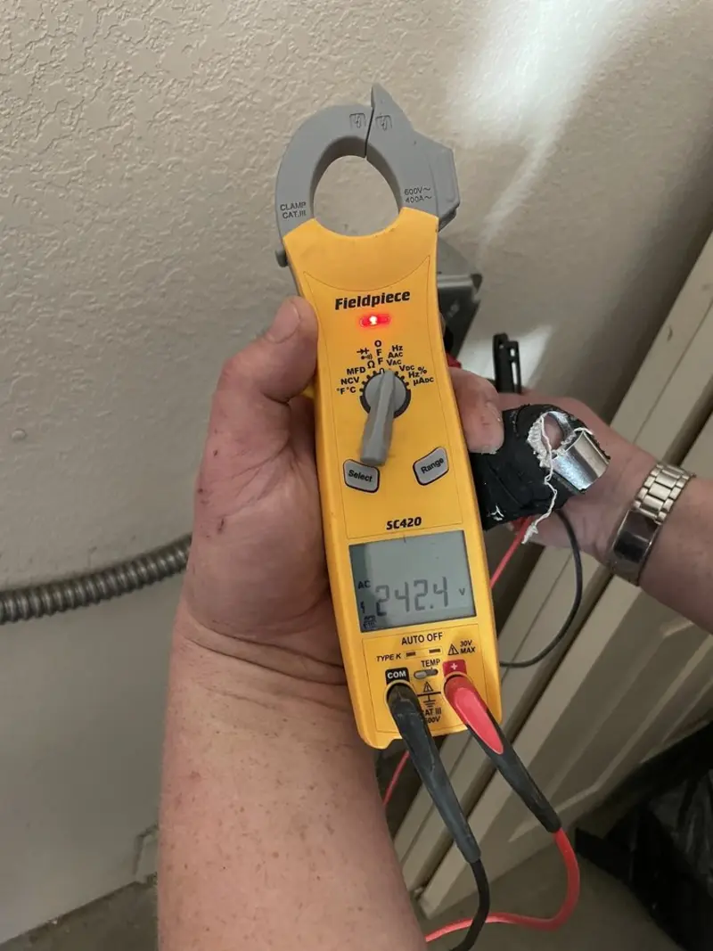 Voltage testing with clamp meter during Recessed Lighting Installation in Wethersfield